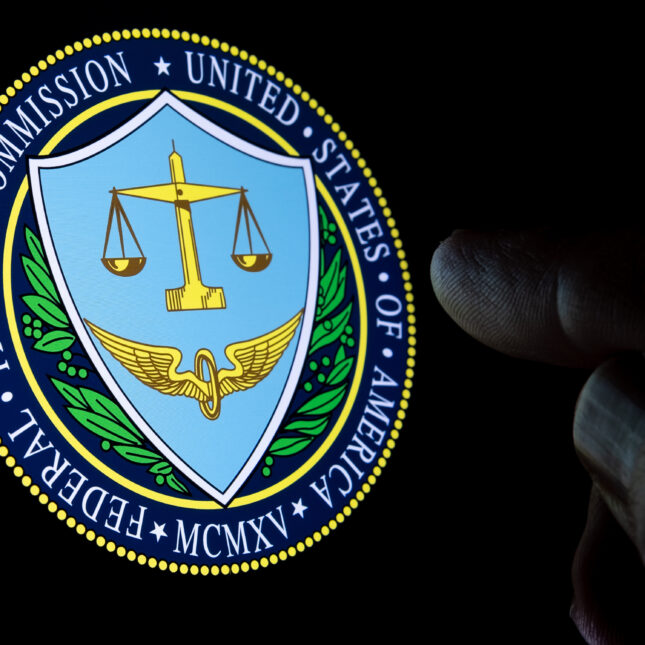Federal Trade Commission logo in the dark with a finger pointing toward it. -- health business coverage from STAT