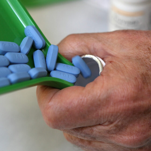 a pharmacist pours Truvada pills into its bottle – first opinion coverage from STAT