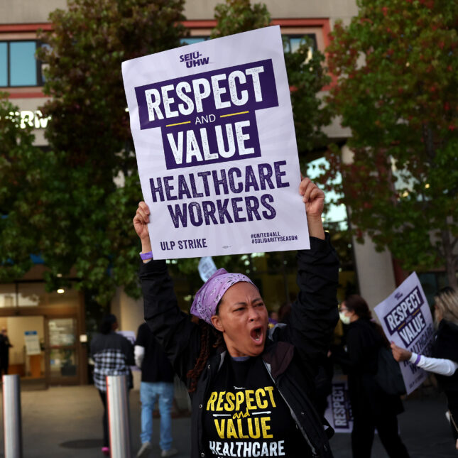 Striking Kaiser Permanente workers hold signs as they march in front of the Kaiser Permanente San Francisco Medical Center on October 04, 2023 in San Francisco. The sign reads, "Respect and value healthcare works." -- coverage from STAT